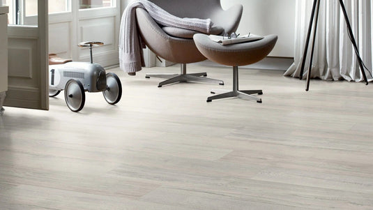 elbe grey oak plank laminate flooring on display in a living area