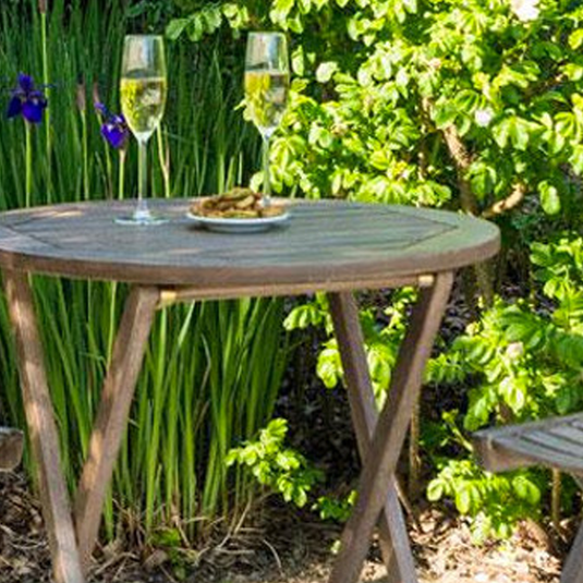 round wooden table in a brown colour