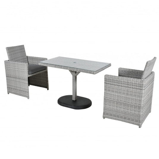 grey bistro set - 2 armchairs with dark grey cushions and a glass topped rectangular table with a hole centrally situated within the table for a parasol