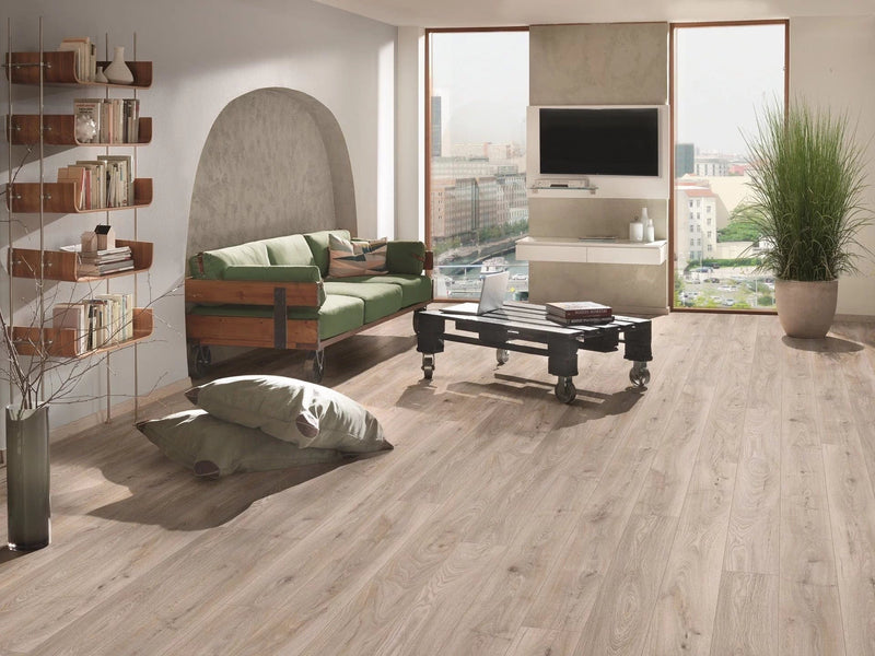 Załaduj obraz do przeglądarki galerii, hardy oak aqua long laminate flooring on display in a living area
