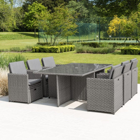 grey 6 seater cube set with glass topped rectangular table and 6 ottomans