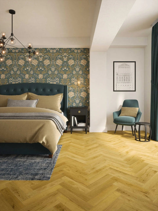 albi honey oak herringbone laminate flooring on display in a bedroom