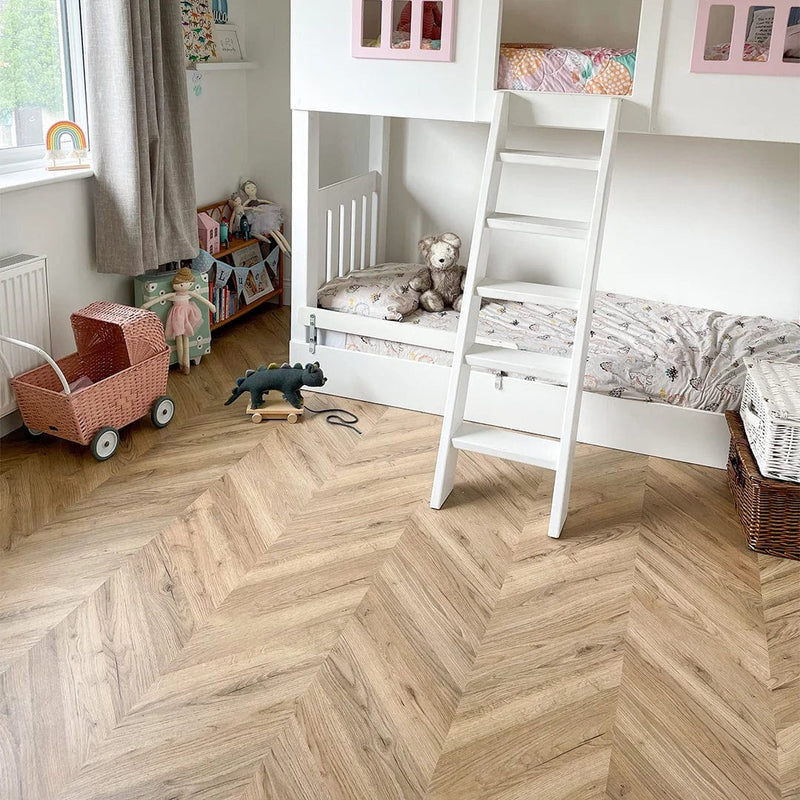 Załaduj obraz do przeglądarki galerii, dark rillington oak laminate flooring on display in a bedroom in a chevron pattern
