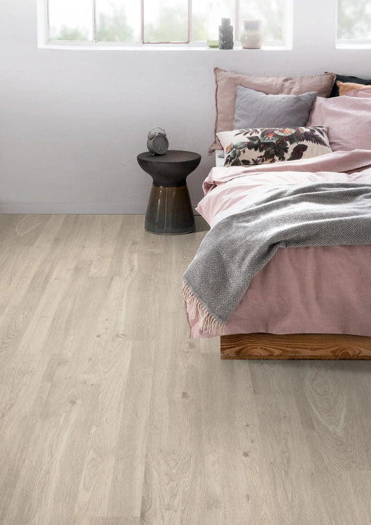 white corton oak grey laminate flooring displayed in a bedroom