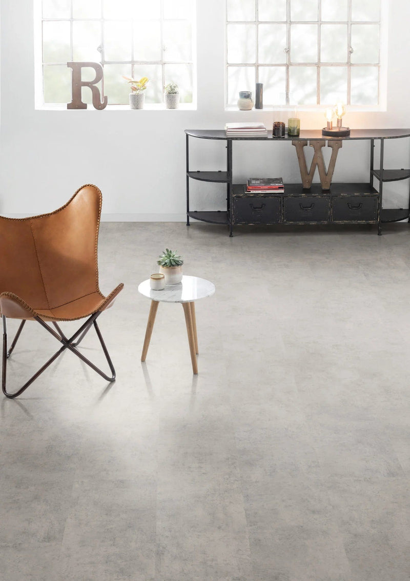 Load image into Gallery viewer, light grey chicago concrete aqua laminate flooring on display in a living area
