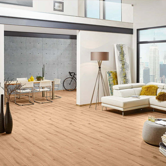 golden vista oak aqua laminate flooring on display in a living area