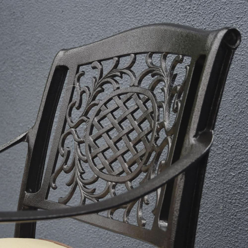 Load image into Gallery viewer, bronze armchair with design on the back of the chair
