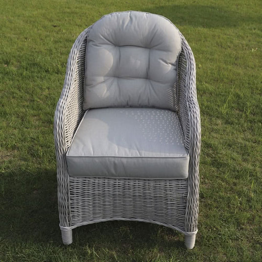 grey curved armchair with grey back and base cushions