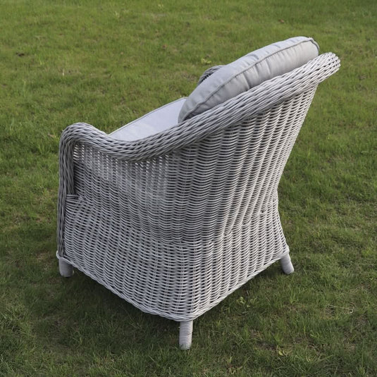 grey curved armchair with grey back and base cushions