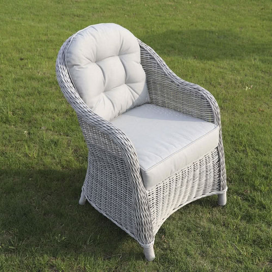 grey curved armchair with grey back and base cushions