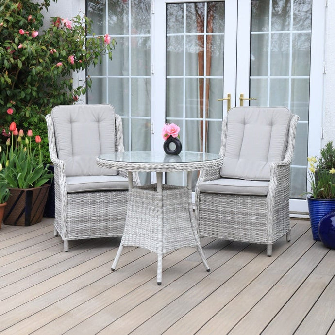 white washed bistro set with round glass topped table