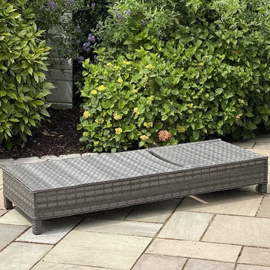 dark grey woven synthetic rattan lounger without cushions