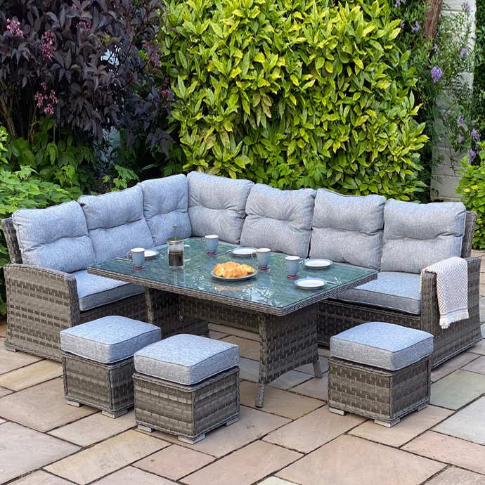 dark grey casual dining set with rectangular glass topped table and 3 stools