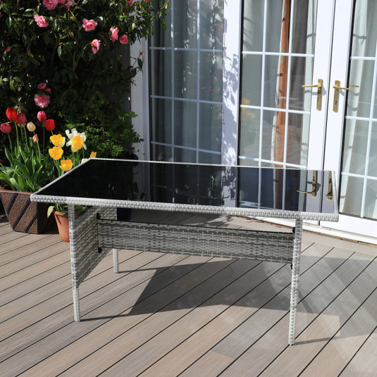 light grey rectangular table with glass top