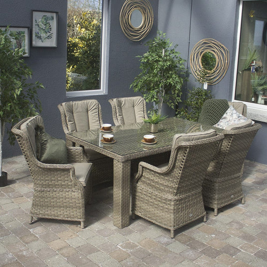 6 seater set with a rectangular glass topped table in a natural colour