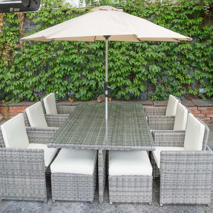 cream 6 seater garden furniture set with 4 stools and a rectangular glass topped table