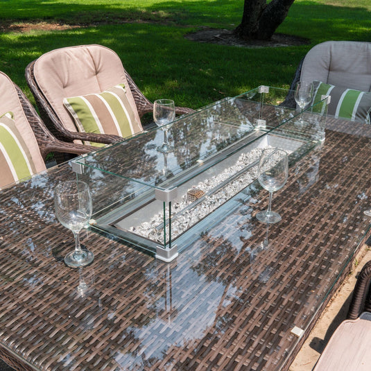 firepit centrally situated on the glass topped rectangular table