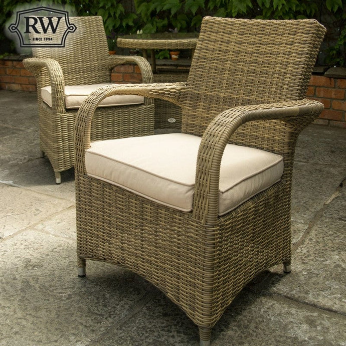 woven synthetic rattan armchair in a natural colour with 1 beige base cushion