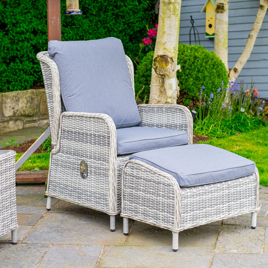 light grey chair & dark grey cushions with reclining feature and a light grey footstool with dark grey cushion