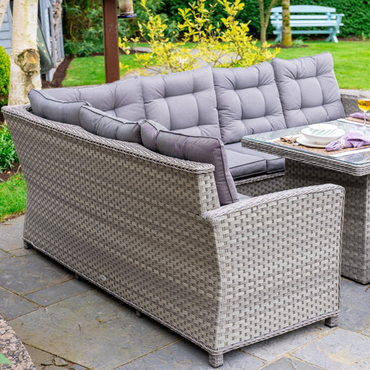 grey corner sofa set with rectangular glass topped table and 3 stools