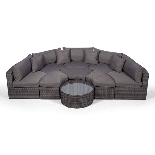 grey sofa set with 3 ottomans and a glass topped coffee table