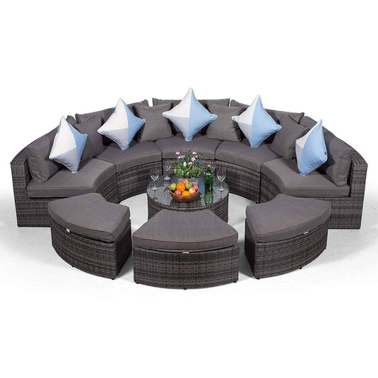 grey sofa set with 3 ottomans and a glass topped coffee table