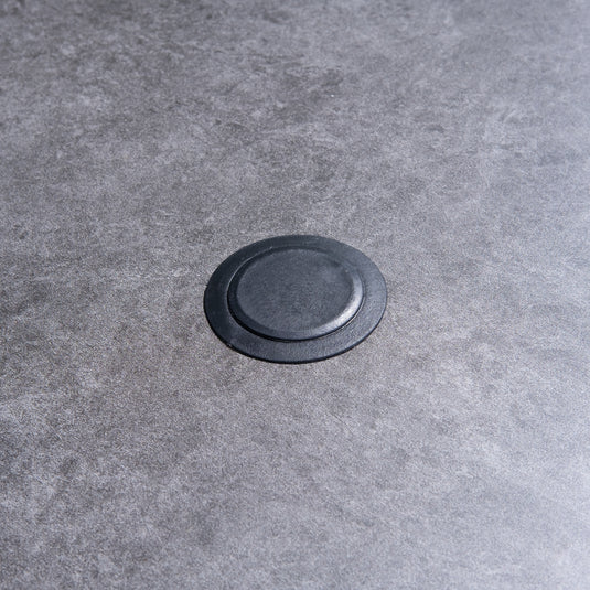 hole for parasol centrally situated within the round table