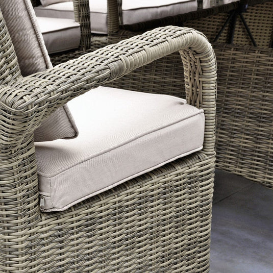 brown woven synthetic rattan armchair with beige base and back cushions