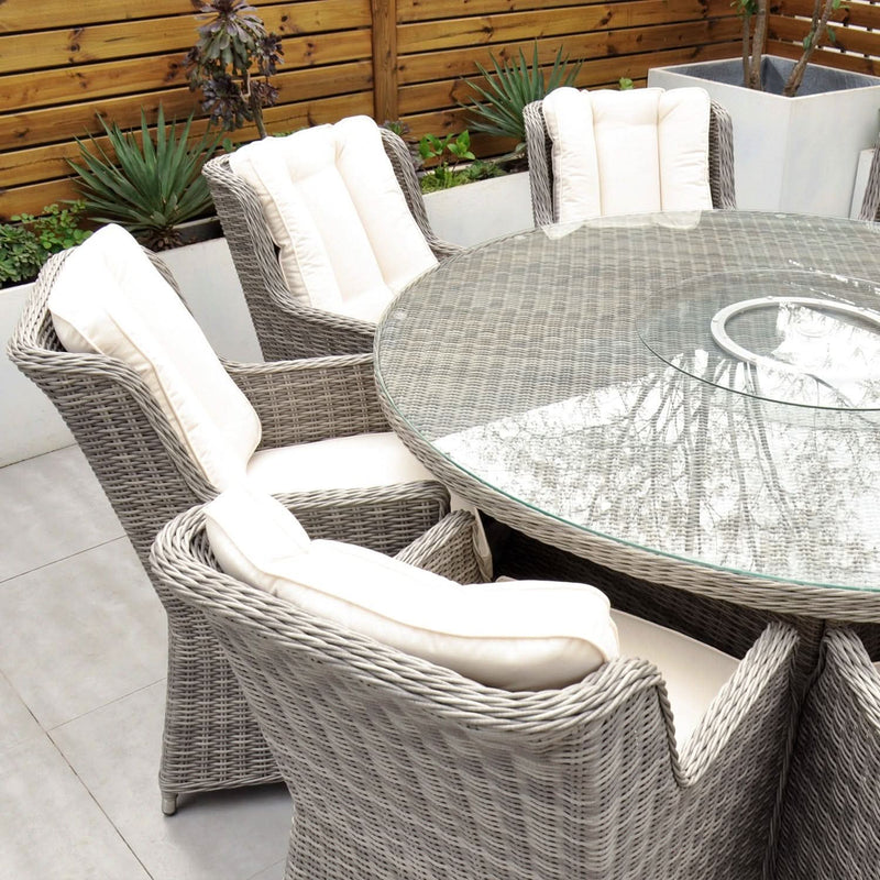 Load image into Gallery viewer, light grey 8 seat set with cream cushions and a 170cm glass topped round table
