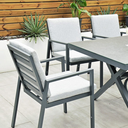 dark grey chairs with cushions and rectangular table