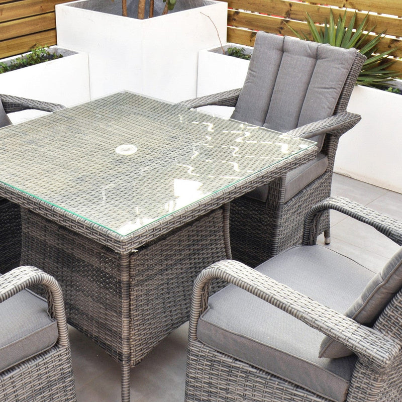 Load image into Gallery viewer, grey 4 seater set with glass topped square table and hole for parasol within table
