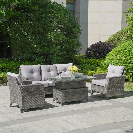 grey sofa set with 1 sofa, 2 armchairs and a glass topped rising rectangular