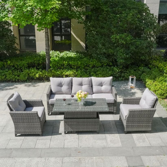 grey sofa set with 1 sofa, 2 armchairs and a glass topped rising rectangular