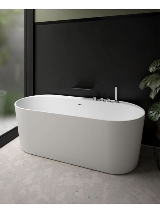 white freestanding bath with waste and overflow